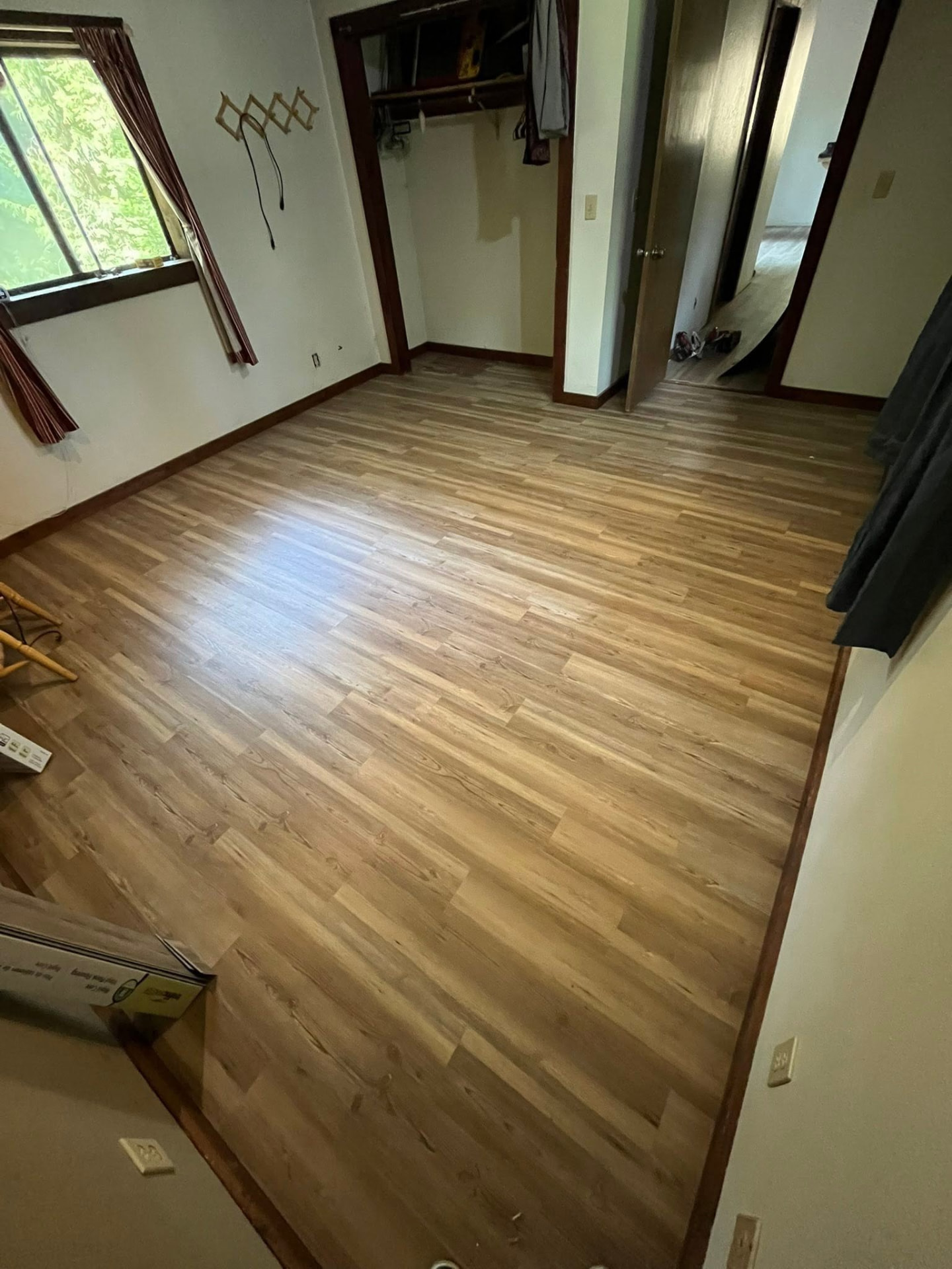 Plank flooring installed wall to wall in a bedroom