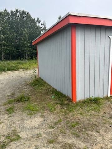 Shed with painted siding and accent trim